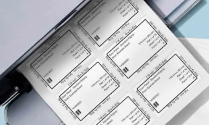 A sheet of printed barcode labels with text details rests atop open folders, each label displaying panel cut details generated from a cutlist optimizer.